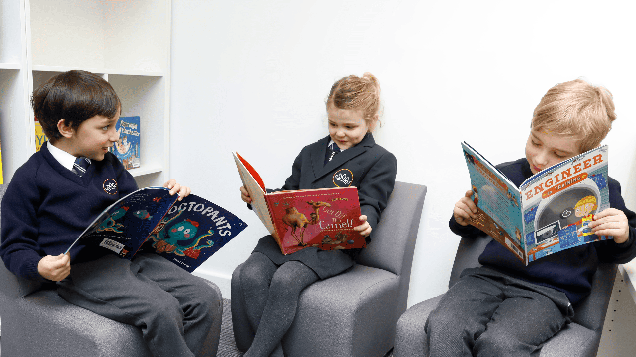 Image of three pupils reading at Crown Street Primary School